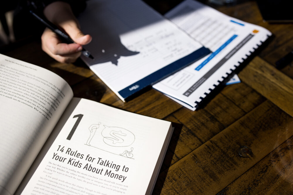 book and papers on desk